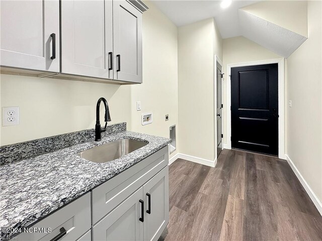 washroom with sink, cabinets, dark hardwood / wood-style floors, hookup for a washing machine, and electric dryer hookup