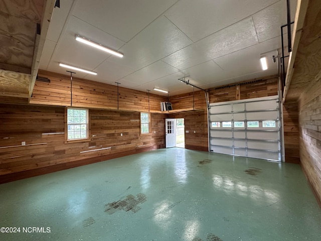 garage featuring wooden walls