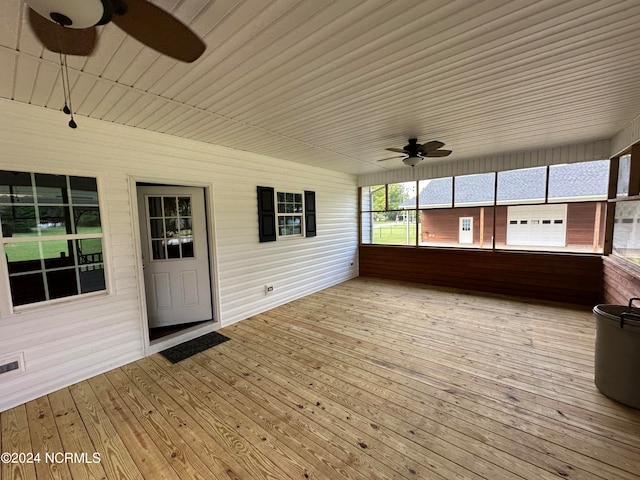 unfurnished sunroom featuring wood ceiling, lofted ceiling, and ceiling fan