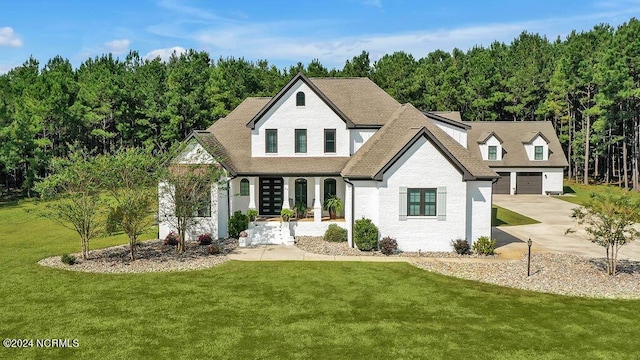 79 Bishop Branch Ln SE, Leland, NC 28451 - view of front of property featuring french doors, a front yard, brick siding, a garage, and a shingled roof