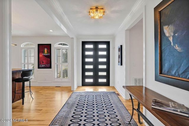 79 Bishop Branch Ln SE, Leland, NC 28451 - entryway featuring light wood-type flooring and crown molding