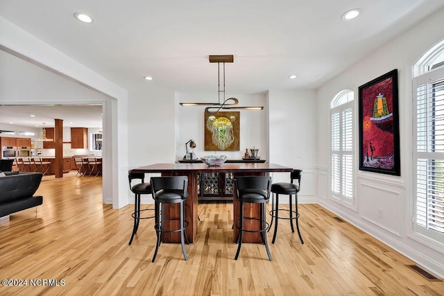 79 Bishop Branch Ln SE, Leland, NC 28451 - dining room with light wood-style flooring, recessed lighting, and a wainscoted wall