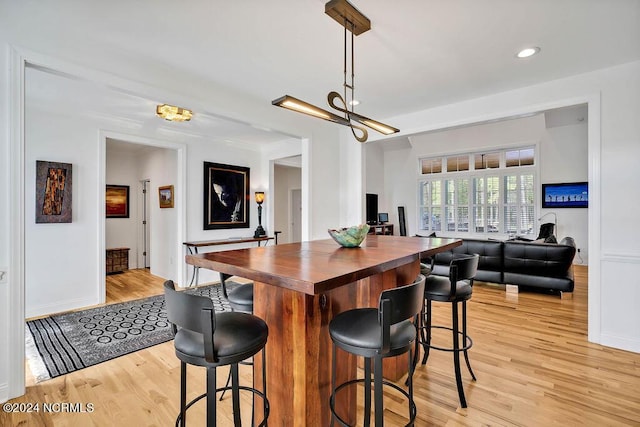 79 Bishop Branch Ln SE, Leland, NC 28451 - dining area with light wood-style floors, baseboards, recessed lighting, and a chandelier