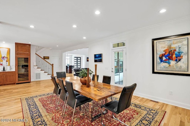 79 Bishop Branch Ln SE, Leland, NC 28451 - dining room with stairs, light wood finished floors, ornamental molding, recessed lighting, and baseboards