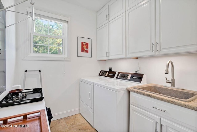 79 Bishop Branch Ln SE, Leland, NC 28451 - washroom featuring washer and dryer, cabinet space, baseboards, and light stone finish flooring