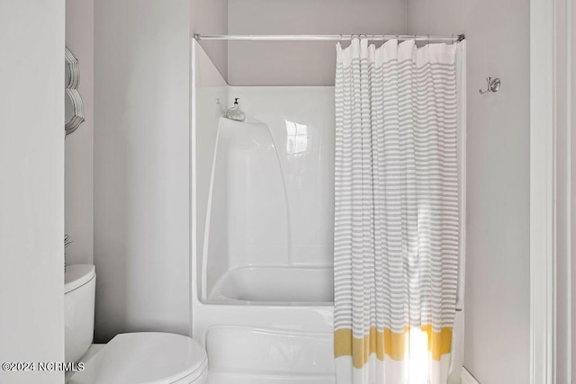 79 Bishop Branch Ln SE, Leland, NC 28451 - bathroom with toilet and shower / bath combo with shower curtain