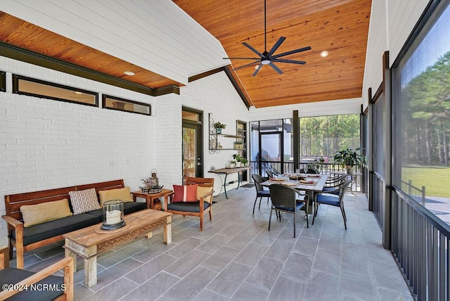 79 Bishop Branch Ln SE, Leland, NC 28451 - sunroom with wooden ceiling, an outdoor hangout area, ceiling fan, lofted ceiling, and brick wall