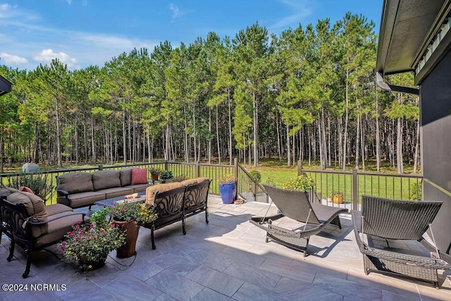 79 Bishop Branch Ln SE, Leland, NC 28451 - view of patio / terrace featuring an outdoor living space and a view of trees