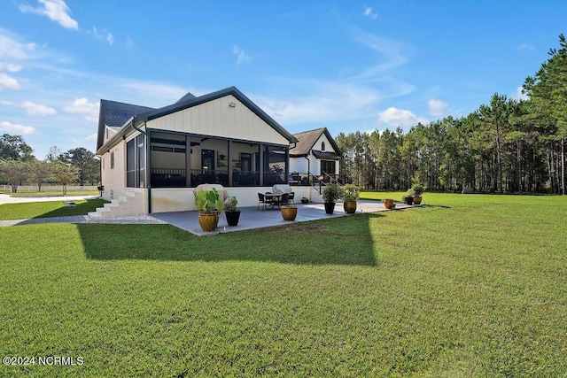 79 Bishop Branch Ln SE, Leland, NC 28451 - rear view of house featuring a sunroom, a patio area, and a yard
