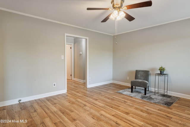 unfurnished room featuring light wood-type flooring, ceiling fan, and crown molding