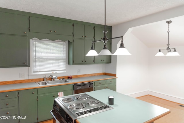 kitchen featuring green cabinetry, pendant lighting, stainless steel appliances, a textured ceiling, and sink