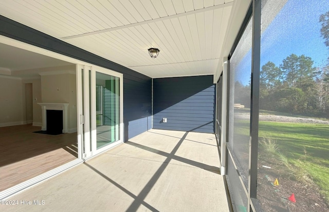 unfurnished sunroom featuring wood ceiling