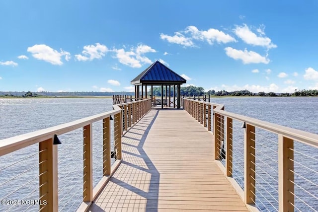 dock area featuring a gazebo and a water view