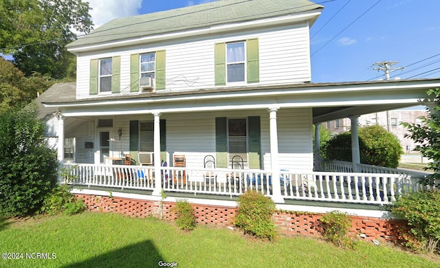 country-style home featuring cooling unit and covered porch