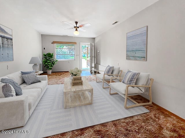 living room with ceiling fan and carpet floors