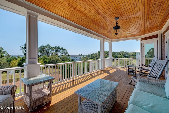 wooden deck featuring an outdoor hangout area