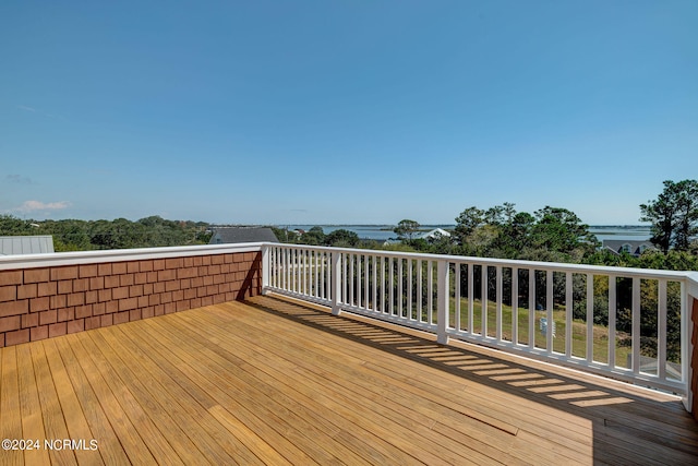 deck featuring a water view