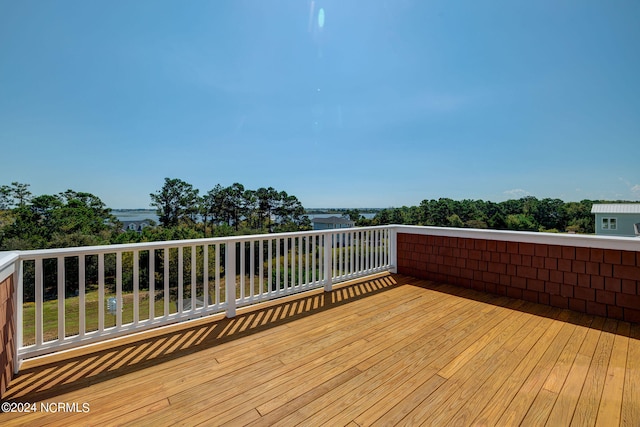 wooden deck featuring a water view