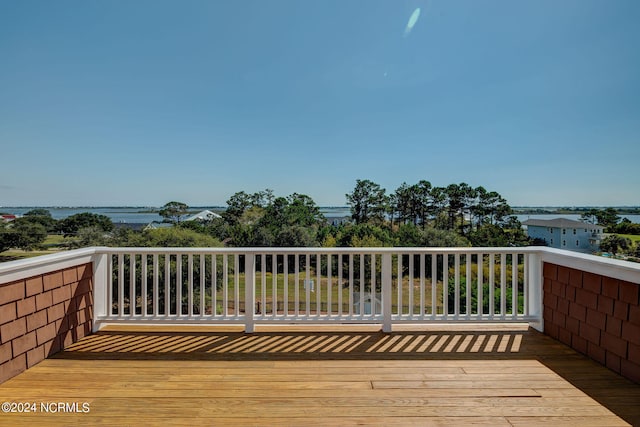 wooden deck with a water view