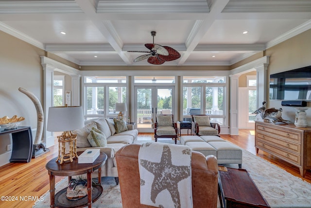 living room with french doors, light hardwood / wood-style flooring, crown molding, and decorative columns