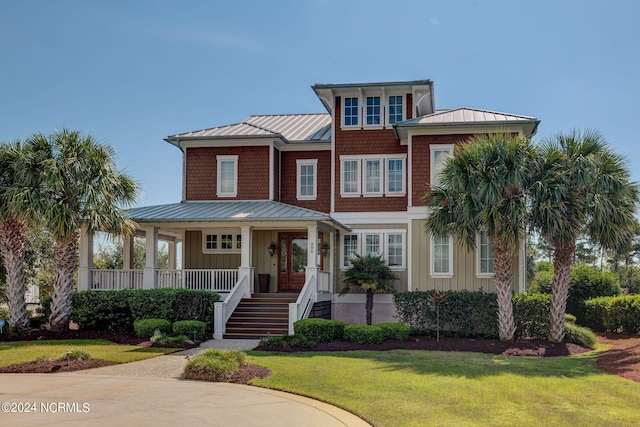 view of front of property with a front yard and a porch