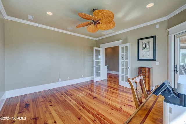 interior space with ornamental molding, ceiling fan, light hardwood / wood-style flooring, and french doors