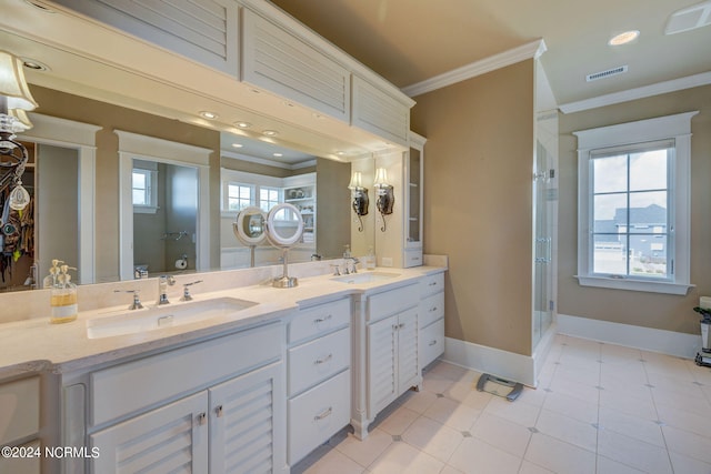 bathroom featuring tile patterned floors, an enclosed shower, vanity, and crown molding