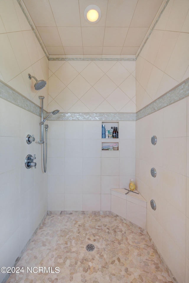 bathroom with tiled shower