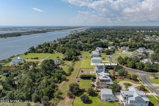 drone / aerial view featuring a residential view and a water view
