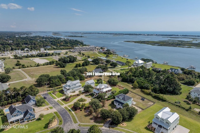 birds eye view of property featuring a residential view and a water view