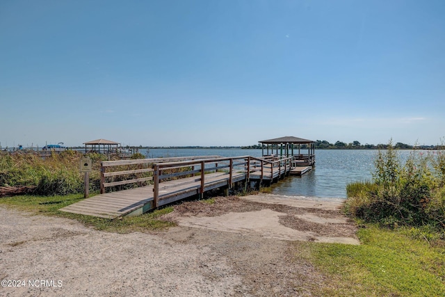dock area featuring a gazebo and a water view