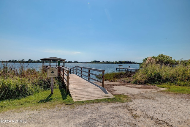 dock area with a water view and a gazebo