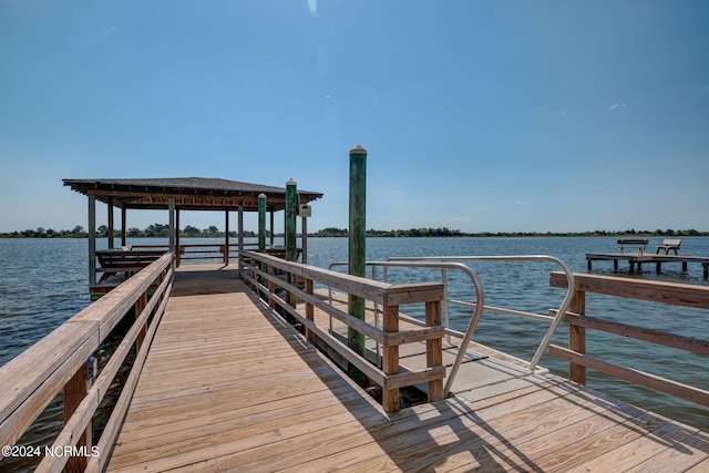 view of dock with a water view