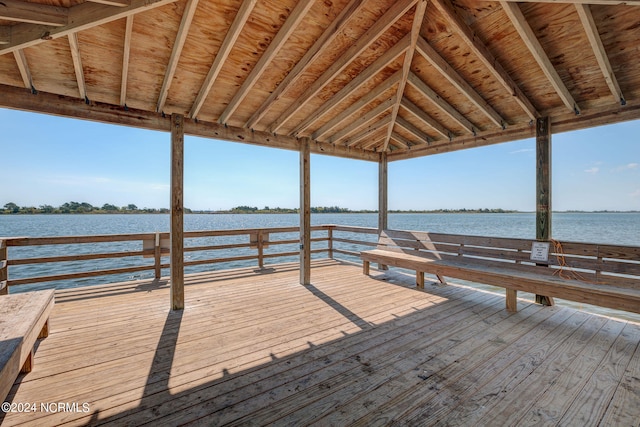 view of dock featuring a deck with water view