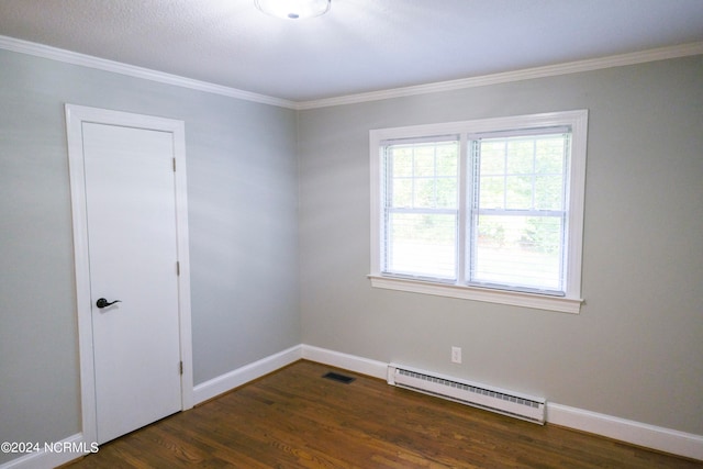 spare room with a baseboard radiator, dark hardwood / wood-style floors, and ornamental molding