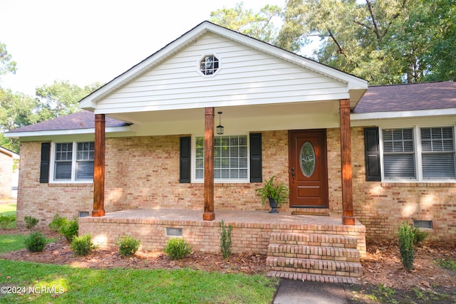 ranch-style home with a porch