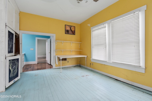 unfurnished living room with hardwood / wood-style floors