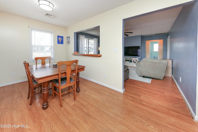 dining space with light wood-type flooring