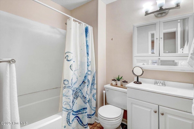 full bathroom featuring shower / tub combo with curtain, vanity, and toilet