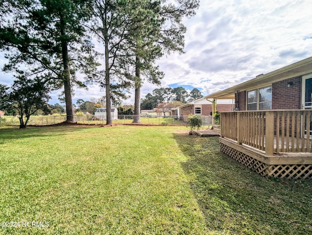 view of yard with a deck