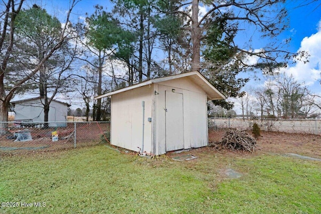 view of outbuilding featuring a yard