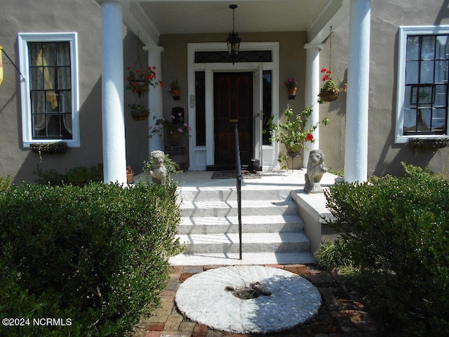 property entrance with covered porch