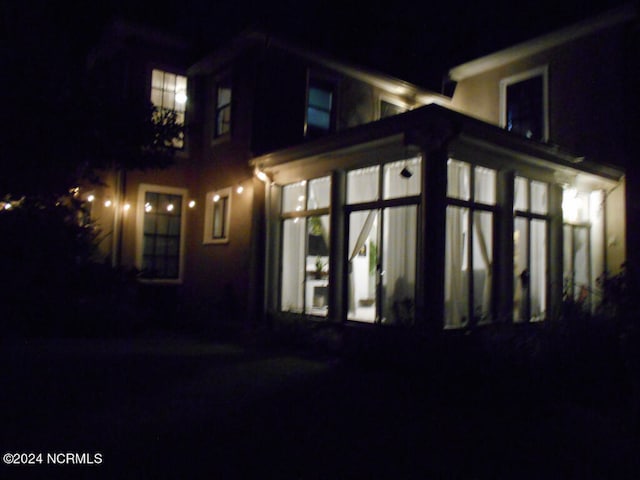 exterior space featuring a sunroom