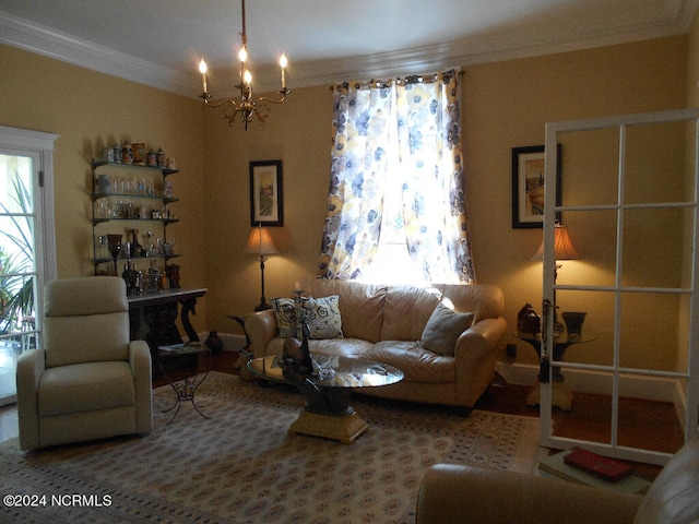 living room with a notable chandelier and ornamental molding