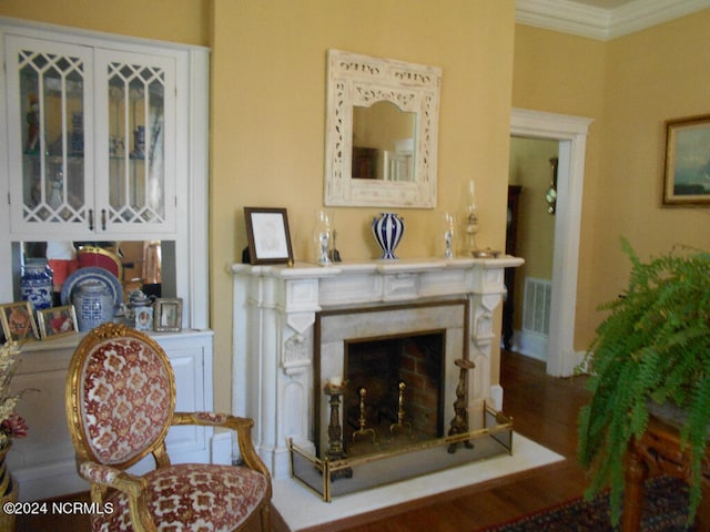 living room featuring ornamental molding and hardwood / wood-style floors