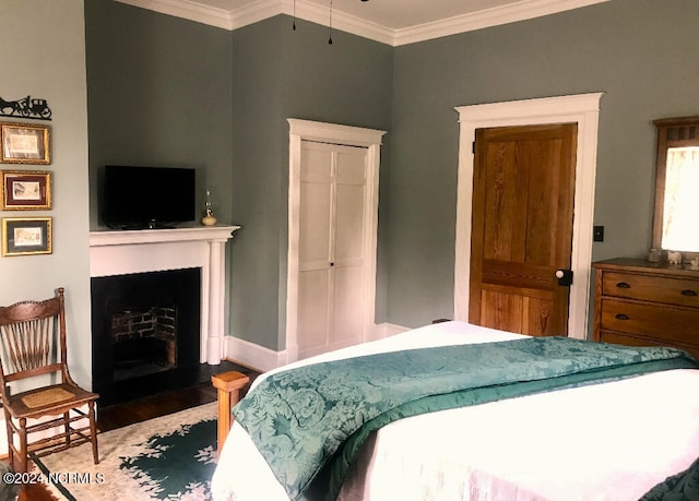 bedroom featuring hardwood / wood-style flooring and ornamental molding