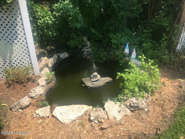 exterior details featuring a small pond