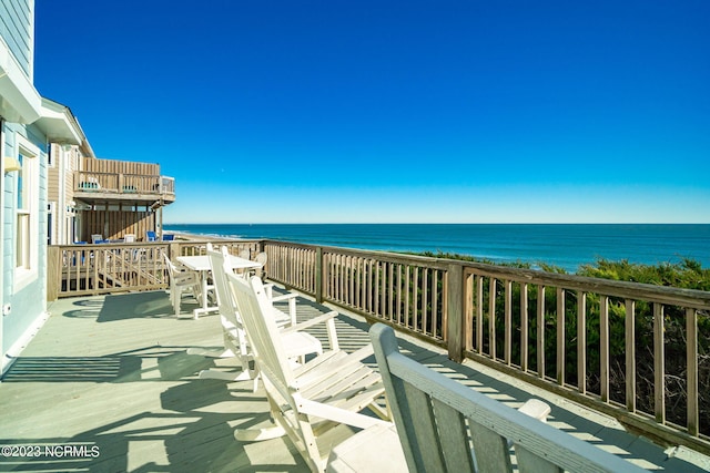 balcony with a deck with water view