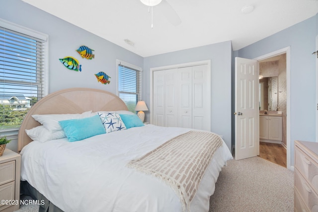 bedroom with ceiling fan and a closet