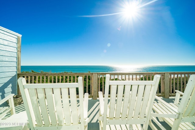 balcony with a view of the beach and a water view